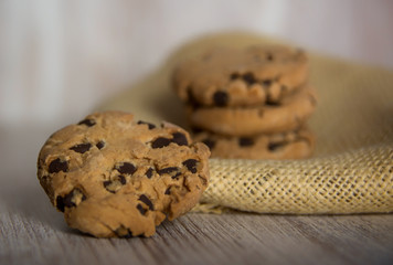 Set of chocolate chip cookies, on a linen napkin. Closeup and depth of field