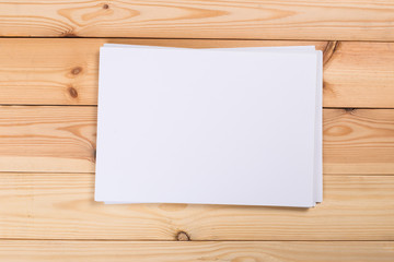 white paper on wood background and shadow