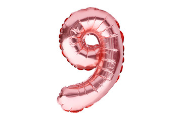Number 9 nine, made of rose golden inflatable helium balloon. Gold pink foil balloon font part of...