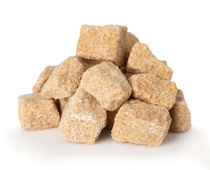 Brown crushed sugar close-up isolated on a white background.