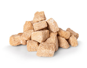 Brown crushed sugar close-up isolated on a white background.