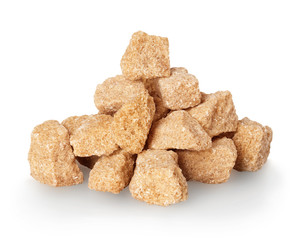 Brown crushed sugar close-up isolated on a white background.