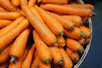 Fresh orange carrots for sale at a farmers market