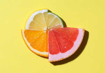 Citrus fruits slices in sunlight. Summer fruits context