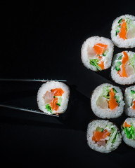 sushi on a black background