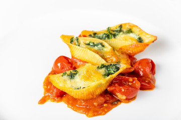 italian conchiglino pasta filled with spinach