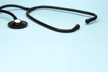Medical stethoscope on blue background. Healthy and care