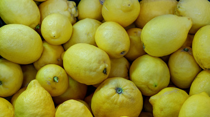 yellow lemons on market stall