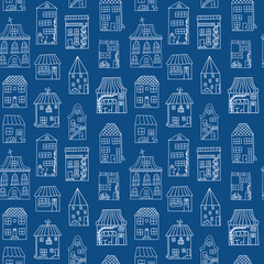 Seamless pattern with cute houses in doodle style. White houses are painted by hand on a dark blue background.
