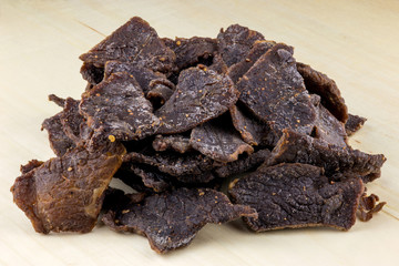 Beef Jerky On A Wooden Table Top