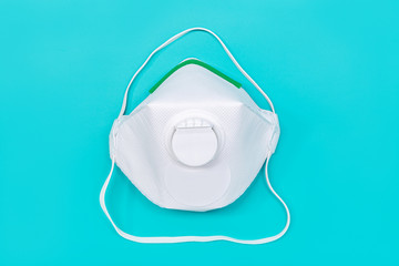 Safety mask FFP2 isolated on green background. Virus or pollution protection concept