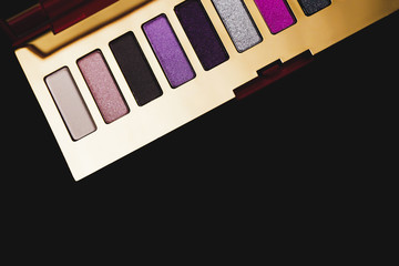 Professional multicolor eyeshadow palette. Trendy makeup concept.