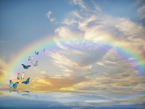 Spiritual background for meditation with butterflies and rainbow 