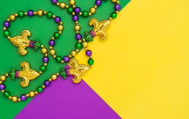 Mardi gras carnival decoration beads background © LiliGraphie