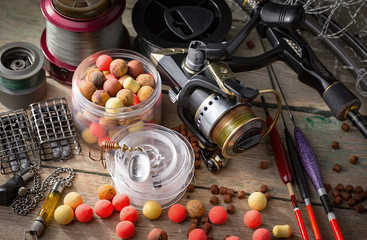 fishing tackle on a wooden table.