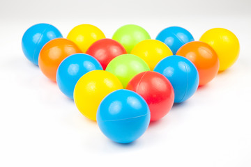 Colored plastic balls on white background. leisure and game items. round objects