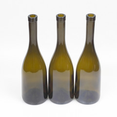 Three empty wine bottles on white background