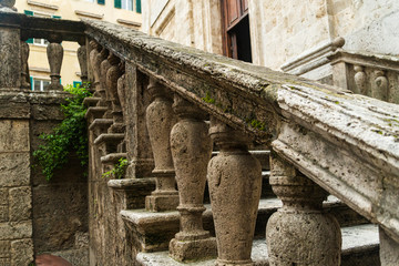 Naklejka premium Handrail of Little church through the street of Siena, Italy.