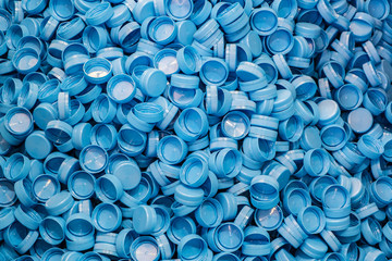 Plastic bottle caps background. Recycling collection and production processing plastic bottle caps