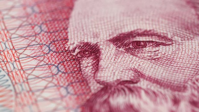 Friedrich Engels on East German banknote macro rotating. Famous socialist philosopher, communist, social scientist, collaborator of Karl Marx. Low angle. 4K, 422 10 bit