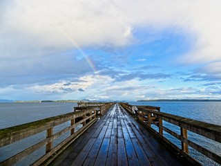 Rainbow over fishing pier in Sidney