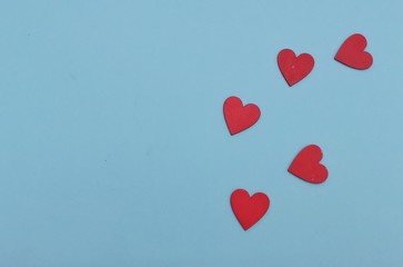 Valentine's Day background. White and red hearts on pastel blue background. Valentines day concept....