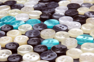 different mother of pearl buttons on fabric