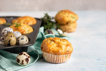 Savory muffins with bacon, quail egg, green onion and cheese on a light stone background. Protein breakfast. Paleo or keto diet.