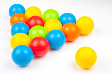 Colored plastic balls on white background. leisure and game items. round objects
