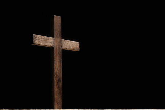Christian cross on dark background