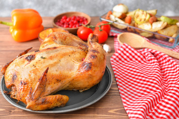 Tasty baked turkey for Thanksgiving day on table