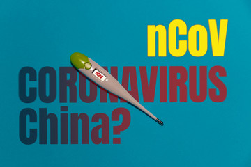Novel Coronavirus (nCoV), WUHAN virus concept. Thermometer on a blue background with CORONAVIRUS...