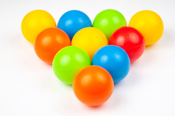Colored plastic balls on white background. leisure and game items. round objects