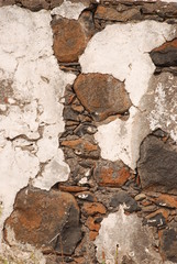 old ruined white wall with bricks