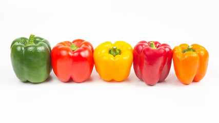 different colored sweet and bitter peppers on a white background. vitamin food