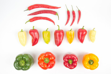 different colored sweet and bitter peppers on a white background. vitamin food