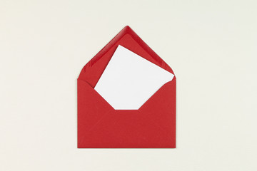 The red envelope with white blank paper. Background.