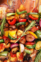 Grilled pork shish or kebab on skewers with vegetables . Food background shashlik