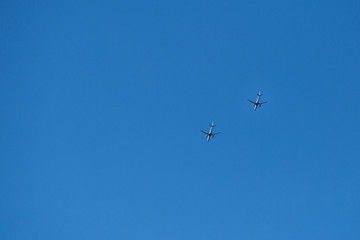 two planes in the blue sky