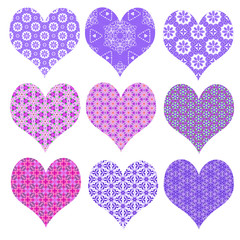 Pretty set of heart shapes in purple and pink isolated on white. Symbols of love for Valentines Day. Can be cut out separately. 