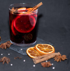 mulled wine, cinnamon and dried oranges