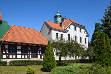 Fototapeta na wymiar Kajki Square (former market square) and town hall from 1825 in Mragowo, Masuria, Poland