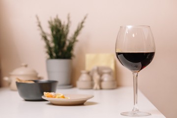 Glass of red wine on the kitchen table