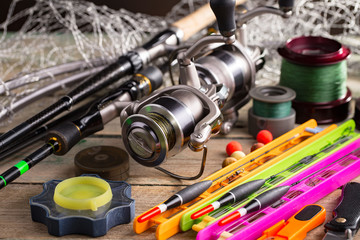 Spinning and fishing rods on an old background