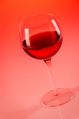 Wine glass with red background