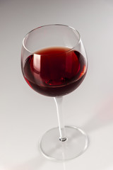 Wine glass with red background