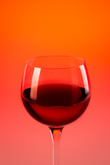Wine glass with red background