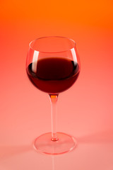 Wine glass with red background