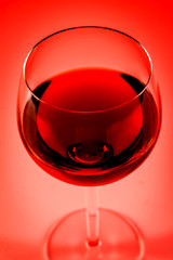 Wine glass with red background