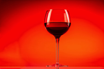 Wine glass with red background